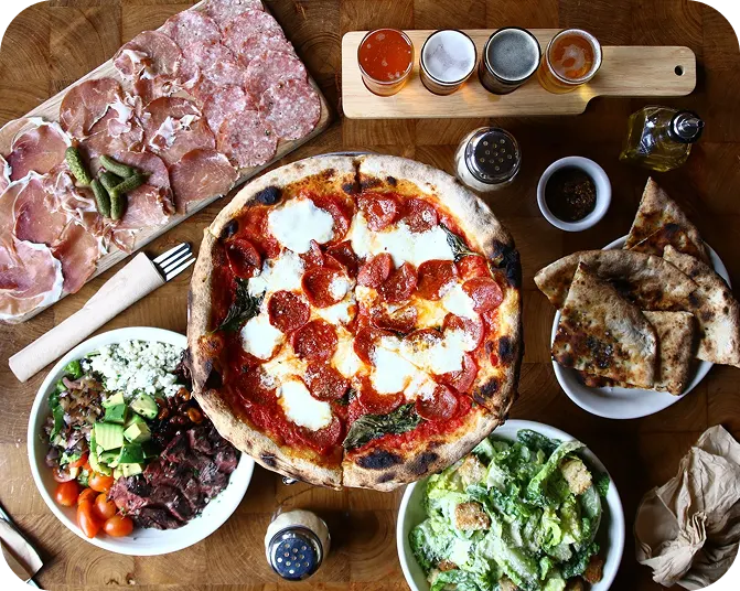 Diners sharing pizza at a table